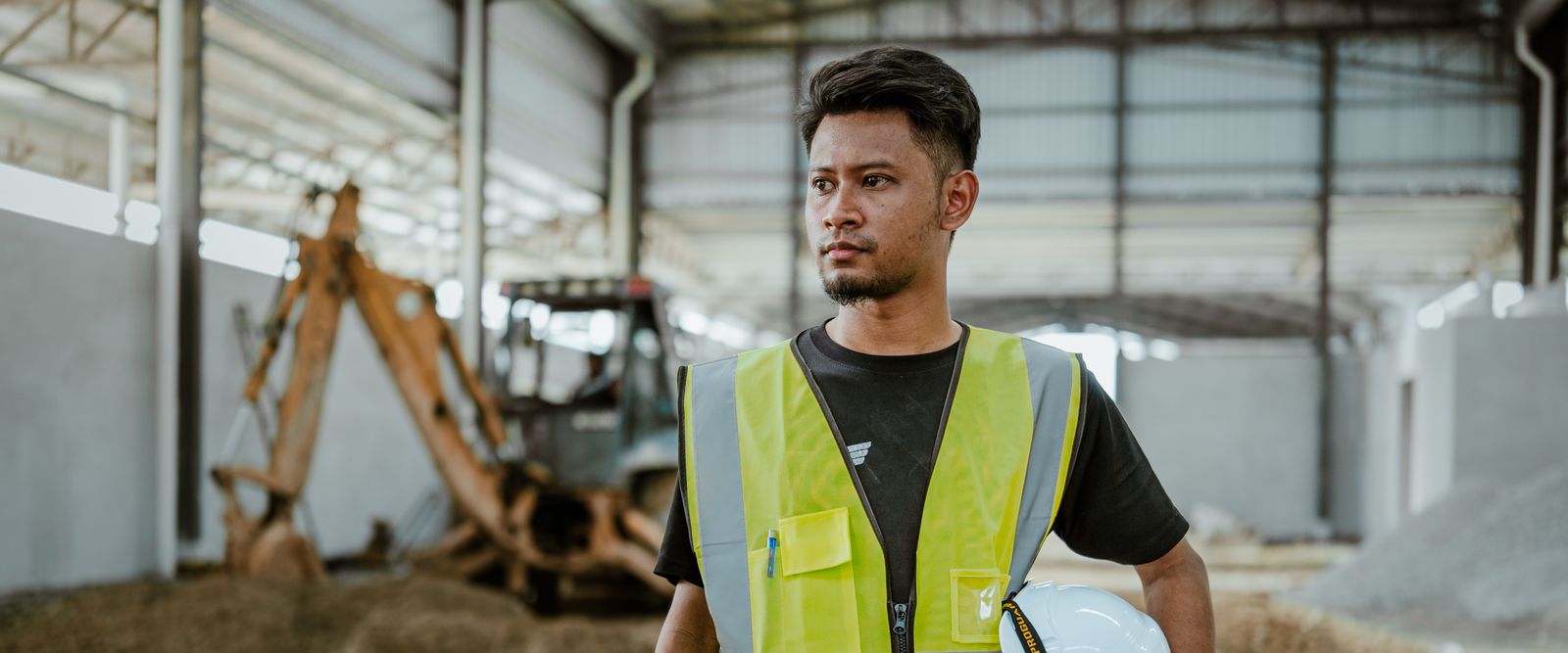 Construction worker holding a hard hat